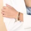 Joyería de moda europea y americana de comercio exterior, pulsera de acero inoxidable con cierre dorado para mujer, versión estrecha, pulsera de acero de titanio.