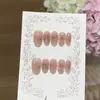 Un par de uñas postizas [Diseño de Flor Brillante], puras y seductoras, degradado rosa melocotón, talladas intrincadamente, con detalles de diamante triturado y purpurina plateada, hechas a mano