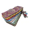 Bolsa de brocado para faja esbelta al por mayor de fábrica bolsa de mano bordada estilo chino bolsa de mano para jugar bolsa larga retro para peines