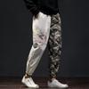 Pantalones de trabajo retro personalizados con dragón plateado bordado de estilo chino de otoño e invierno de 2021 para hombre, tendencia al por mayor