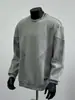 Sudadera de cuello redondo con empalme y manga larga, estilo americano moderno, marca nueva de otoño 2025, suéter sencillo casual gris para hombre