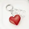 Ins Coreano Dulce Chica Cadena de Corazón Plateado con Lazo Colgante para AirPods Llavero de Chica Decoración Colgante para Bolso