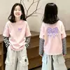 Camiseta infantil listrada de manga longa 2026 novo modelo de algodão puro top moderno e estiloso super fofa roupa de menina