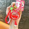 Llavero Colgante de Bola de Cristal Rellena de Aceite con Tema de Fresa, Lindo Encanto de Arena Líquida, Accesorio para Bolsa, Pequeño Regalo para Parejas, Suministro al por Mayor