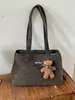 Bolso grande estilo universitario para mujer 2025 nueva moda versátil de un solo hombro simple para clase y desplazamientos bolso tote