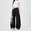 Jeans de mezclilla estilo high street americano con estampado de alas graffiti y costuras visibles, corte holgado para hombre, pantalones de pierna ancha de diseño único para trabajo