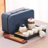 Juego de té de viaje traje portátil para exteriores juego de té kung fu taza rápida de cerámica empresa mayorista regalos publicitarios de negocios