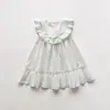 Ropa Infantil Estilo Coreano Vestido de Niña con Cuello Volante Verano 2026 Nuevo Vestido de Princesa sin Mangas de Encaje con Cuello Redondo para Niñas