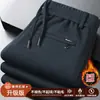 Calça de fleece forrada estilo novo 2026 transfronteiriça para homens, calça casual quente de cintura elástica e perna larga para outono e inverno
