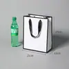 Bolsa de cartón blanco caja de regalo empaque bolso de mano bolsa de compras de regalo para tiendas de cosméticos y ropa, hecho a medida para el Día del Maestro