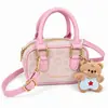 Bolsa Infantil Leve Mini Unissex Bolsa de Boliche para Crianças Estilo Coreano Cor Color Block Moda Acessório com Pingente de Ursinho Fofo
