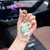 Llavero de caramelo tejido a mano con perlas, un lindo y dulce colgante de hilo, un charm para bolso y un llavero para coche para mujer