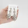 Pendientes Amazon transfronterizos, extragrandes, electrochapados, elegantes, de estilo largo, con un toque de alta gama, adornados con borlas y pedrería negra