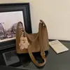 Bolso de mano nuevo para mujer 2026 transfronterizo, un bolso tote ligero y lujoso de gran capacidad, perfecto para el otoño, versátil para el trabajo diario y se puede llevar al hombro o cruzado.