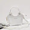 Nuevo bolso tipo cubo de cuero, con una textura suave de cuero PU, versátil bolso cruzado o de hombro, con un asa de cuerda de algodón anudada, un bolso de mano único y elegante para mujer
