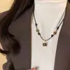 Otoño e Invierno Retro Maillard Imitación Piedra Ojo de Tigre Collar Nuevo Diseño de Nicho Sentido Elegante Moderno Moda Versátil Collar
