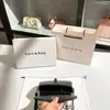 Uma geração de bolsa de mão de lã outono e inverno estilo pequeno perfumado 2025 nova bolsa quadrada pequena de contraste com senso de alta qualidade atacado