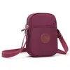 Bolso nuevo para teléfono, minibolso cruzado para mujer, bolso de hombro vertical de tela Oxford, bolso de lona ligero y versátil