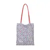 Bolsa de lunares de nicho súper popular estilo coreano para mujer 2026 Nueva bolsa versátil de un solo hombro para llevar debajo del brazo Bolsa pequeña de mano para salir a trabajar