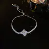 Pulsera Trenzada Hebilla de Herradura Redonda de Circonita Roja Europea y Americana Diseño de Nicho Pulsera Exquisita de Gama Alta para Mujer