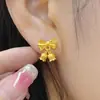 Pendientes Populares de Flor de Lirio del Valle con Lazo de Xiaohongshu para Mujer, Accesorios de Oreja de Flor Mate Estilo Princesa Fugitiva de Lujo Ligero de Nicho Vintage