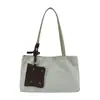 Bolso de mano nuevo para mujer, gran capacidad, versátil para el uso diario, de alta gama, adecuado para ir al trabajo, hecho de gamuza, bolso de hombro, bolso tote, diseño de nicho