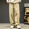 Calças casuais masculinas para primavera e outono, novo estilo japonês, calças retas largas, marca da moda, calças de trabalho masculinas com bom caimento