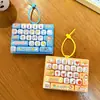 Chaveiro Criativo e Divertido Teclado Descompressão 26 Teclas Filhote, Acessório de Bolsa de Alto Valor Atacado