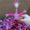 Brinquedo de tubo telescópico girafa com ventosa mutável luminosa transfronteiriça brinquedo de descompressão educacional infantil brinquedo de descompressão dos desenhos animados