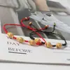 Pulseira de Contas de Dinheiro com Fio Vermelho Fio Preto Cinco Imperadores Fabricante Transfronteiriço Artesanato Atacado