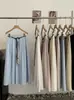 Saia Midi Lisa A-Line de Cintura Alta Semi-Elástica Omalai Estilo Simples Estilo Coreano com Cinto e Lenço 6654