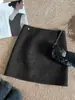 Falda midi de lana de color liso de alta gama para mujer 2026 Otoño/Invierno Nuevo Estilo Coreano Simple Versátil de línea A que se ajusta a la cadera