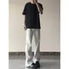 En stock Jeans blancos retro americanos para hombre y mujer verano tendencia marca básica color liso pierna recta pantalones holgados