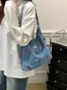 Bolsa de mezclilla multifuncional bordada con cachorro lindo 2026 nueva mochila/bolso de hombro casual de nicho de moda