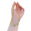 Nuevo estilo chino turquesa pez pequeño pulsera plegable cobre chapado en oro pulsera de cuerda elástica diseño joyería literaria para hombres y mujeres