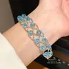 Pulsera hueca abierta tejida en cruz con cuentas, moderna y versátil para el uso diario, de lujo ligero con un toque de alta gama, joyería versátil para mujer