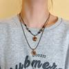 Collar de cuerda de cuero tejido con piedra de ojo de tigre para mujer, otoño e invierno 2024, nueva cadena de suéter popular, estilo retro, temperamento, accesorios que combinan con todo
