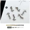 Acessórios para Unhas com Pingente de Cruz Venda Quente Transfronteiriça Estrela Lua Borboleta Liga de Metal Pedras Strass para Unhas Acessórios DIY Atacado