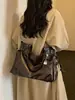 Bolso grande de moda retro para mujer 2026 nuevo bolso casual simple para el antebrazo bolso tote de hombro texturizado para el trabajo