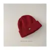Estilo Coreano 2025 Chapéu de Lã Tricotado Infantil com Etiqueta de Ferro Cor Sólida Quente Protetor de Orelha para Bebê Masculino e Feminino Chapéu de Tricô Casual
