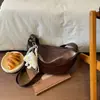 Bolso grande de mujer retro casual 2026 verano nuevo color liso bolsa de albóndiga simple para el trabajo hombro bandolera