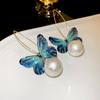 Pendientes de plata con forma de mariposa y flor de perla retro francesa, pequeños y exquisitos, de alta gama, con diseño de hada súper dulce para mujer.