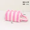 Nova bolsa de maquiagem de grande capacidade para viagens transfronteiriças, bolsa de skincare listrada com design de alça portátil, bolsa de armazenamento para batom