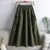 Falda 2023 nueva verano estilo coreano color liso con cordón de amarre bolsillo longitud media talla grande ropa de trabajo falda línea A para mujer