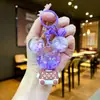 Llavero acrílico con forma de botella de arenas movedizas en aceite, regalo al por mayor, colgante de muñeca de donut, lindo llavero de arenas movedizas.