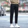 Pantalones casuales de otoño para hombre, estilo nuevo de outlet, versátiles, ajustados, de pierna recta, cónicos, negros para hombre