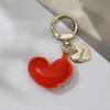 Bolsa Simples de Couro para Fones de Ouvido Chaveiro Bolsa de Viagem Mochila Pingente Pequeno Bolsa de Carro Pingente de Chaveiro Atacado