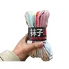 2.5 yuan por manojo de calcetines para vender en mercados de pulgas y puestos callejeros