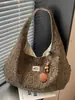 Bolsa de tela de gran capacidad para mujer otoño e invierno 2026 nueva bolsa de lona versátil bandolera estilo perezoso bolsa de mano para ir al trabajo