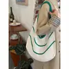 Bolsa de Tricô com Recortes de Grande Capacidade Coreana 2025 Nova Bolsa de Palha para Férias na Praia Nicho Roupas de Trabalho Bolsa de Ombro Versátil